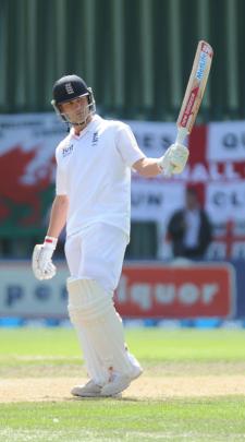 Trott celebrates his 50 on day 5.