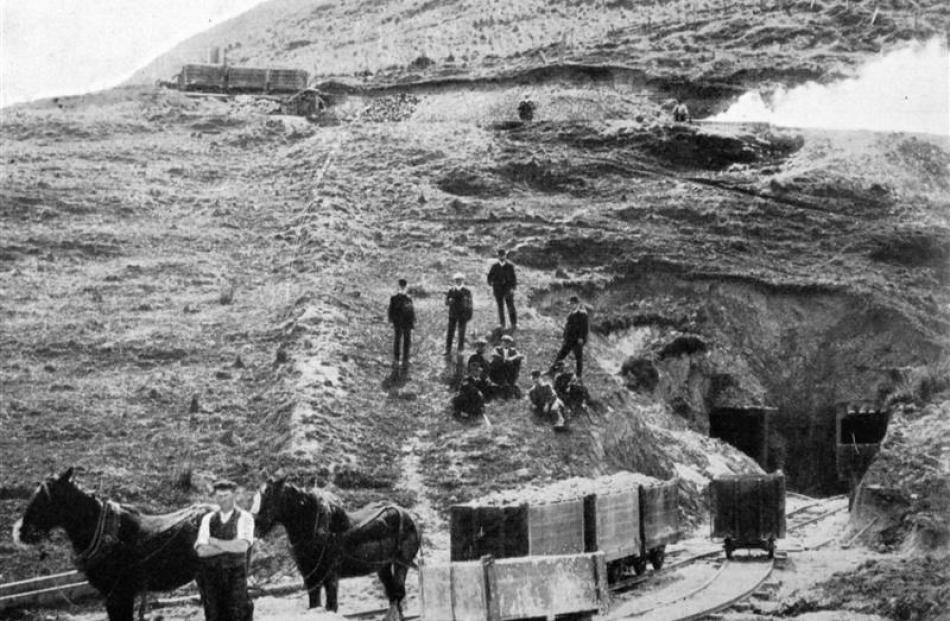 Trucks of burnt limestone emerging from tunnels under the kilns at the Dominion Lime and...