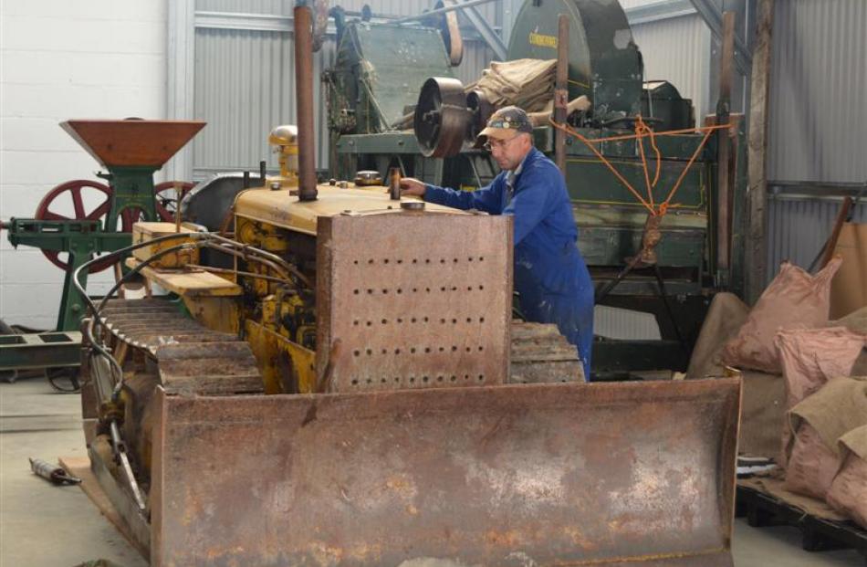 Tuapeka Vintage Club vice-president Gordon Duthie starts a 1950s Caterpillar D2 bulldozer at the...