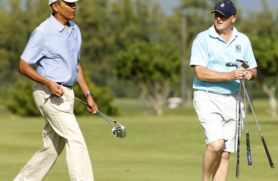 U.S. President Barack Obama plays golf with New Zealand Prime Minister John Key at Marine Corps...