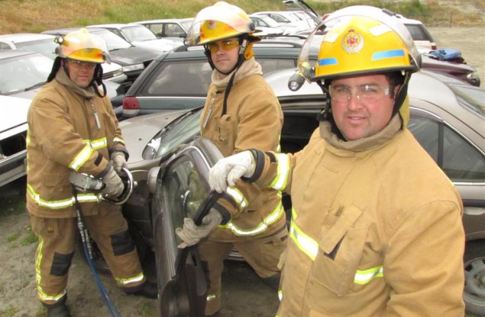 Queenstown  firefighter Preston Rogers-Brown (left), senior firefighter Eoin Kelly and station...