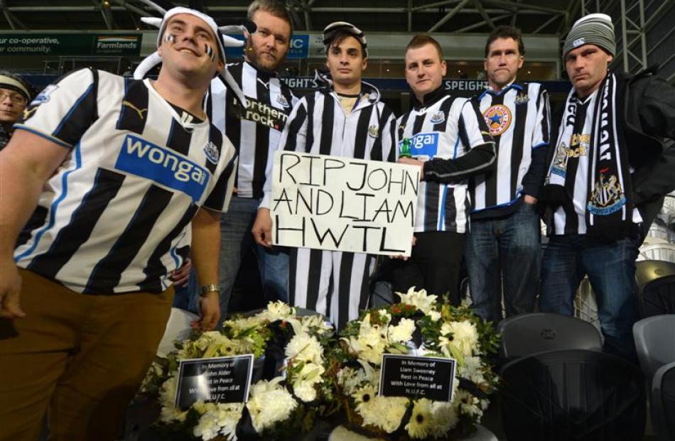 United fans John Alder and Liam Sweeney at Forsyth Barr Stadium last night are (from left) Devin...