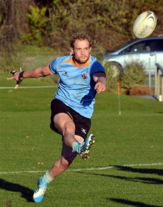 University A centre Matt Faddes kicks downtown during the students' 60-8 drubbing of Dunedin at...