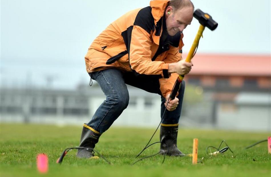 University of Otago geologist Associate Prof Andrew Gorman, equipped with hammer and ear plugs,...
