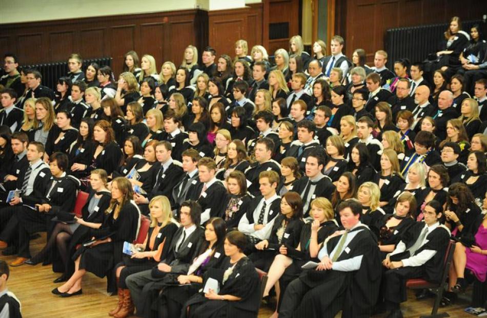 University of Otago graduands (left) prepare to graduate at the Dunedin Town Hall on Saturday....