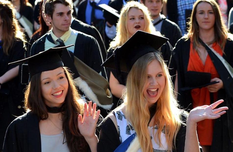 University of Otago graduands Mercy Moxhan (21, left) and Alex Noble (21) during their graduation...