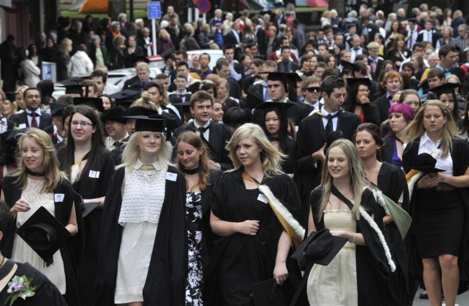 University of Otago graduands take part in an academic parade along Stuart St, Dunedin, before...