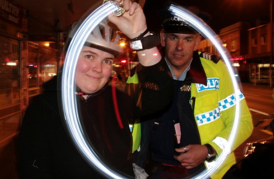 University of Otago student Katrina Monaghan tries out some of the cycle lights being handed out...