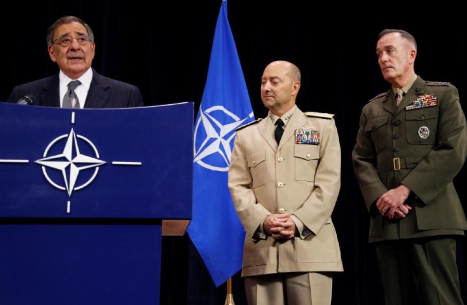 US Secretary of Defense Leon Panetta addresses a news conference next to Supreme Allied Commander...