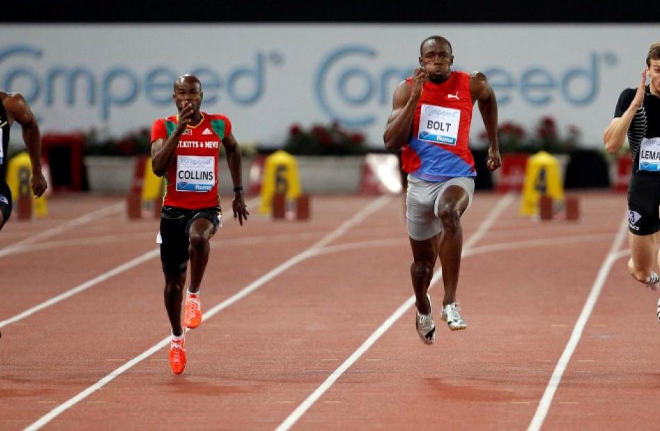 Usain Bolt (2nd R) of Jamaica on his way to winning the men's 100m at the Golden Gala IAAF...