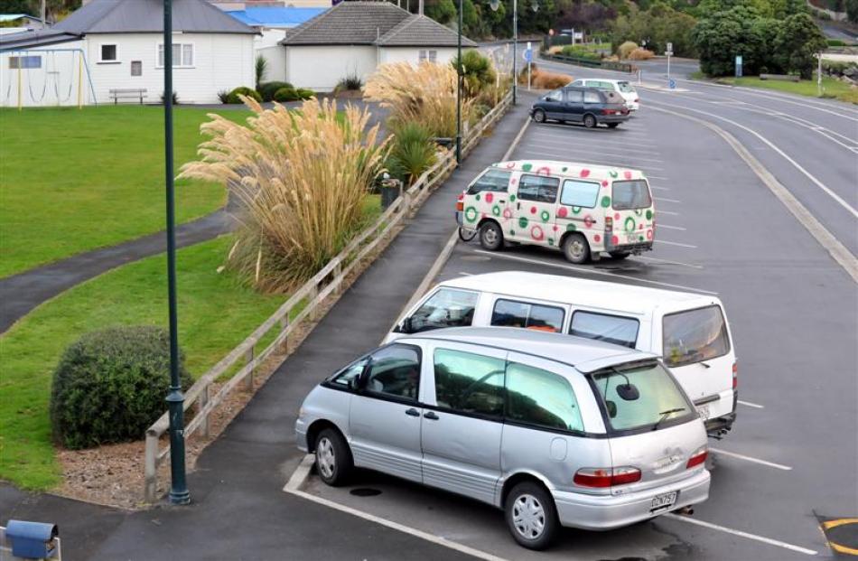 Vans parked at Ralph Ham Park in Macandrew Bay. Photo by Gregor Richardson.
