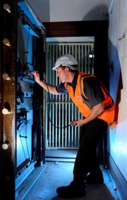 Vault technician Justin Legg, of Dunedin, in the safe he opened at the former chief post office...