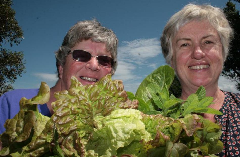 Vegetables in My Back Yard members Margaret Scott (left) and Kitty Caldwell inspect the latest...