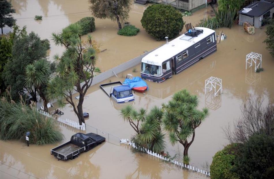 Vehicles swamped by floodwaters at Henley on Saturday. Photo by Stephen Jaquiery.