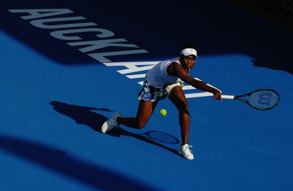 Venus Williams reaches to return a shot during her three-set loss to Daria Kasatkina at the ASB...