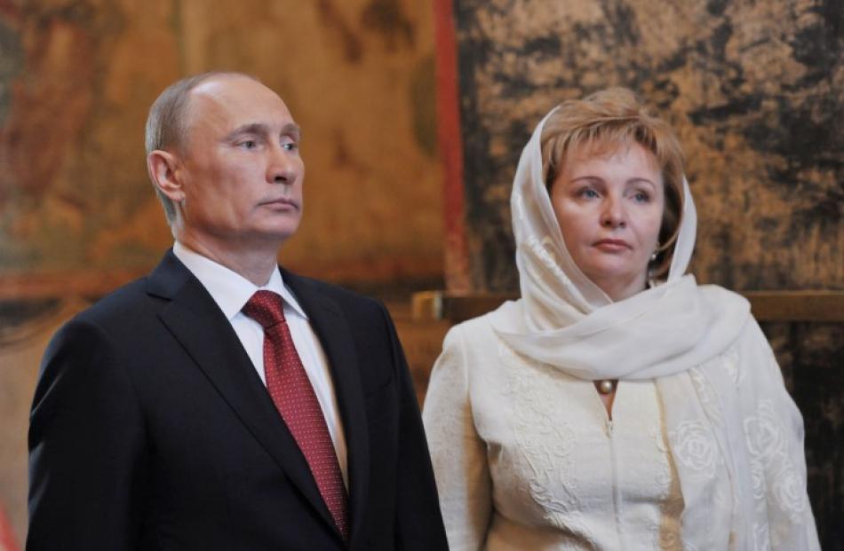 Vladimir Putin and his wife, Lyudmila, attend a service to mark the start of his term as Russia's...