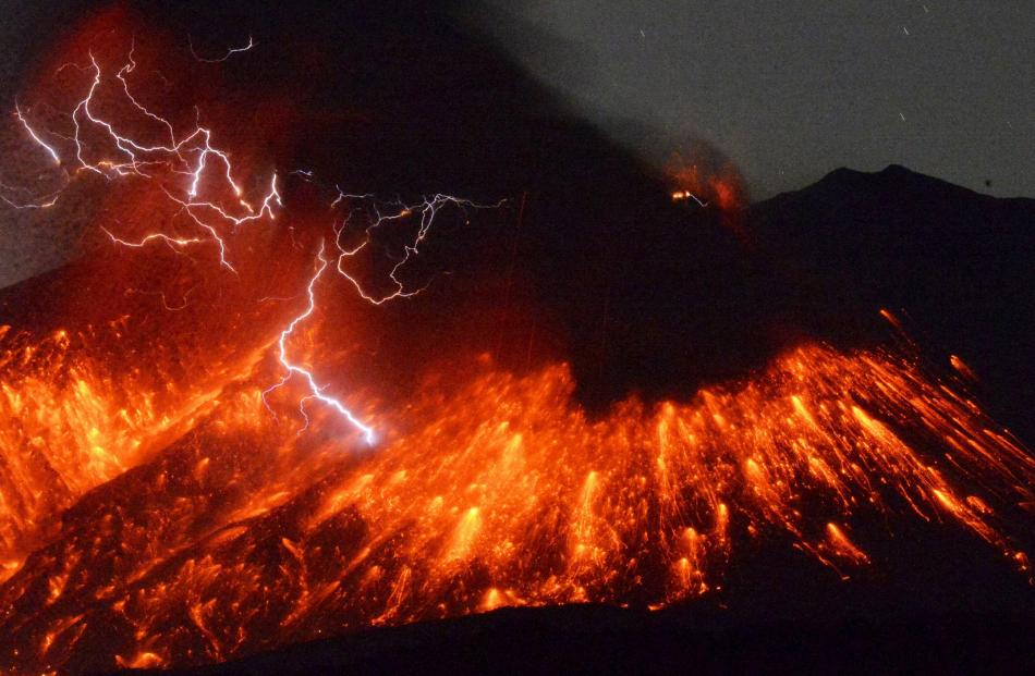Volcanic lightning is seen at an eruption of Mount Sakurajima, in this photo taken from Tarumizu...