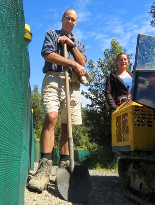 Volunteer Jeff Cleugh and Orokonui Ecosanctuary ranger Kelly Gough finish work on the new kiwi...