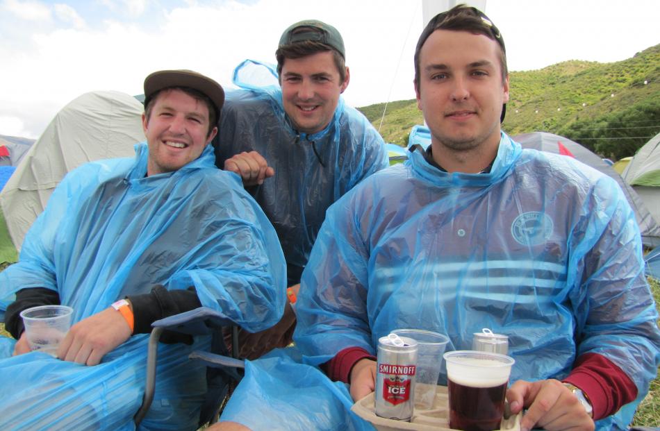 Ready for rain are Cam Bain, Ryan Littlejohn and Dillen Von Solms, all of Dunedin. Photos by Mark...