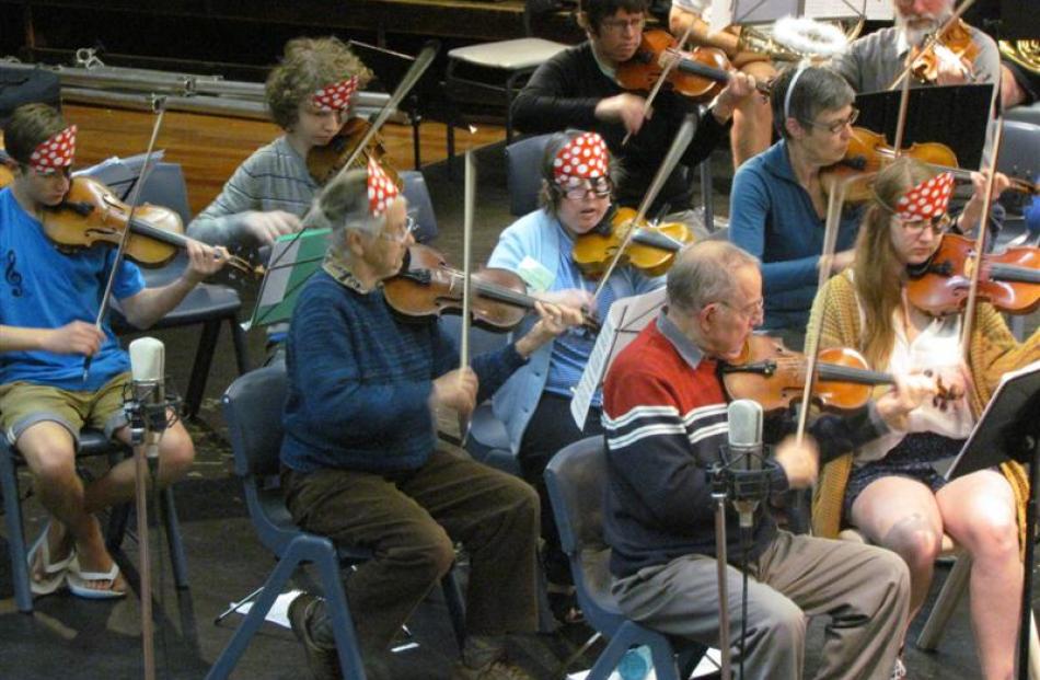 Waitaki Summer Music  Camp members take a fancy-dress rehearsal yesterday.