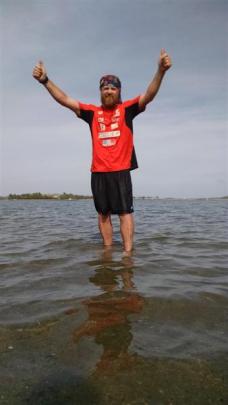 Wanaka man Jup Brown celebrates the end of his charity run across the United States while ankle...