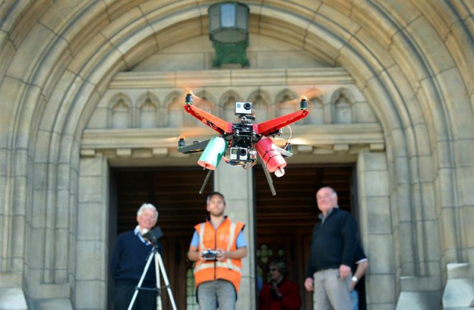 Watching the XP2 Monster Quadcopter  at St Paul's Cathedral yesterday are (from left) cathedral...