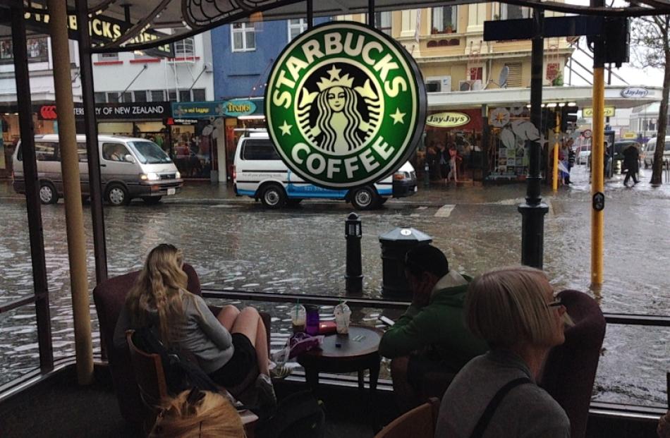 Water lies on George Street during the downpour. Photo by Alex Hedley.