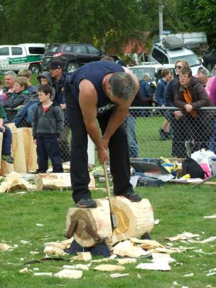 Wayne Corbin, of Riverton, competes in the woodchopping section.