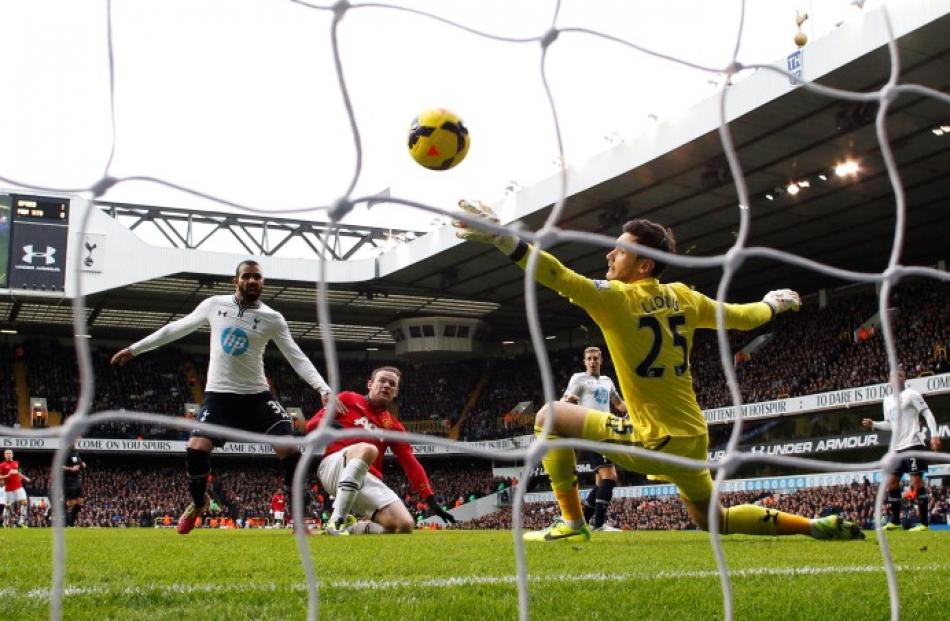 Wayne Rooney (C) scores a goal past Tottenham Hotspur's goalkeeper Hugo Lloris. REUTERS/Suzanne...