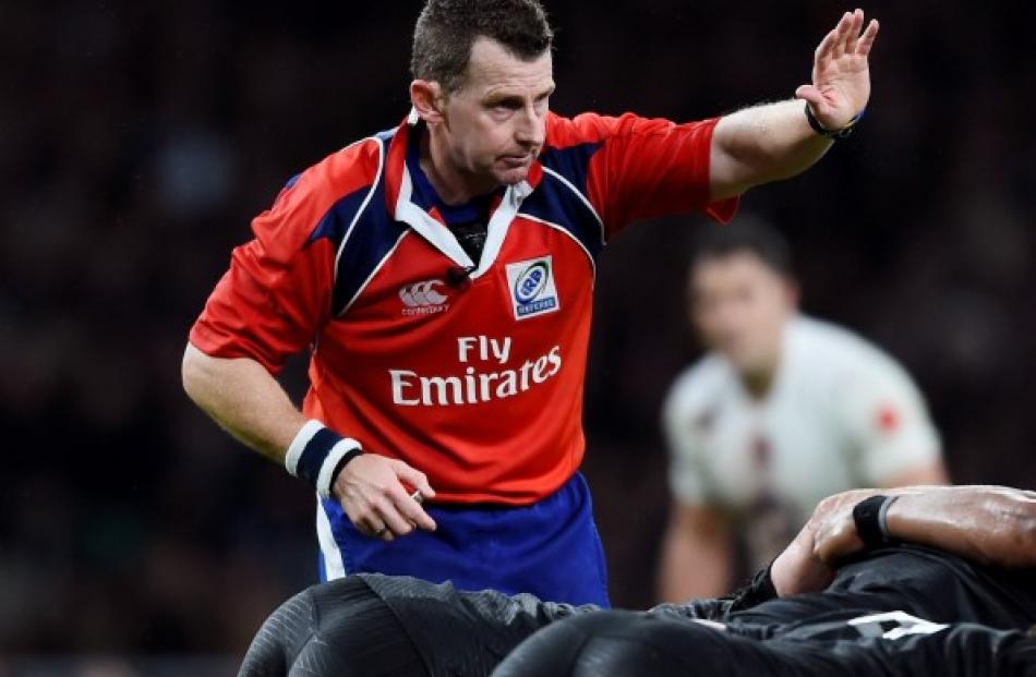 Welsh referee Nigel Owens in action during the test between England and the All Blacks at...