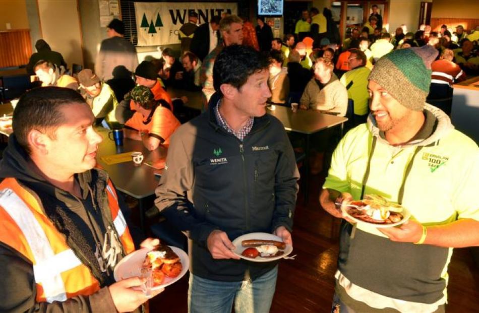 Wenita Forest Products chief executive David Cormack (centre) shares breakfast and a joke with...