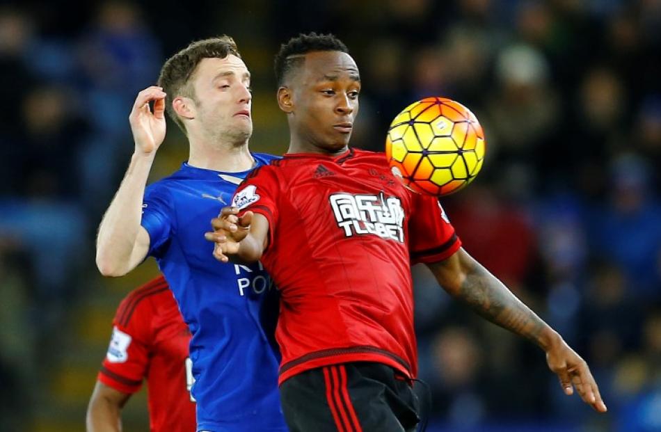 West Brom's Saido Berahino (R) in action with Leicester City's Andy King. Photo: Reuters