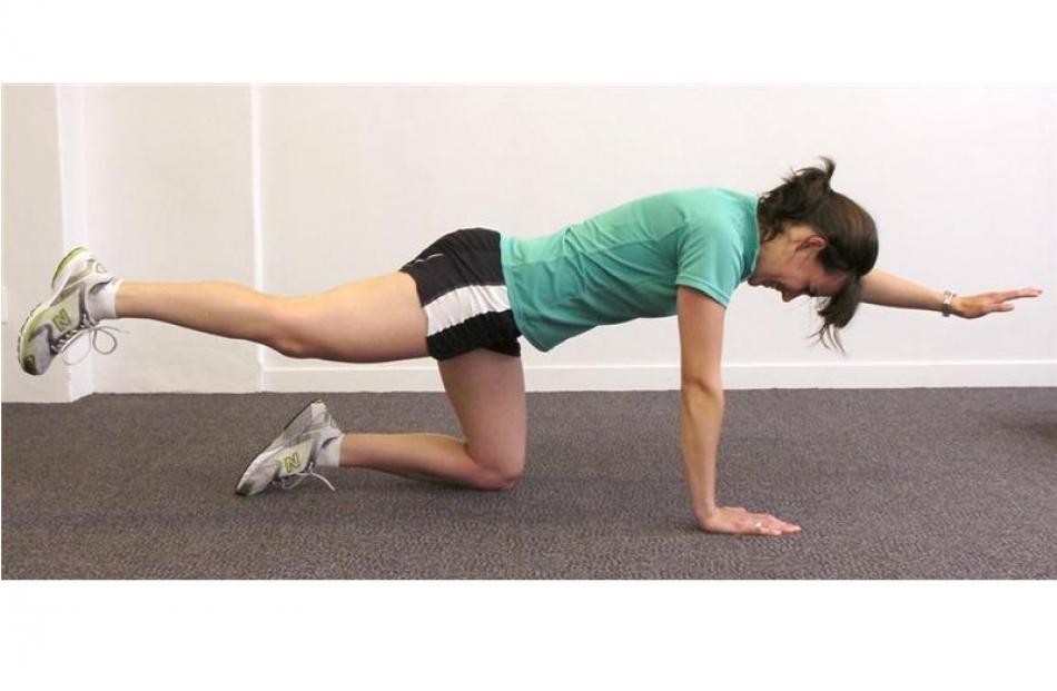 While keeping your back in a comfortable position with your head down, slowly raise your arm and...