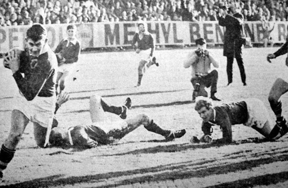 Winger Dave Edward crosses for Otago's first try against the Lions in 1966. Photo from ODT files.