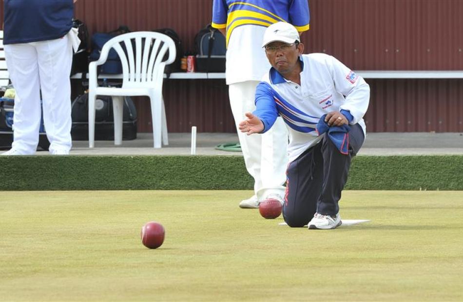 Winning skip Joko Susilo plays a bowl during the final of the Kaikorai Festival Fours at...