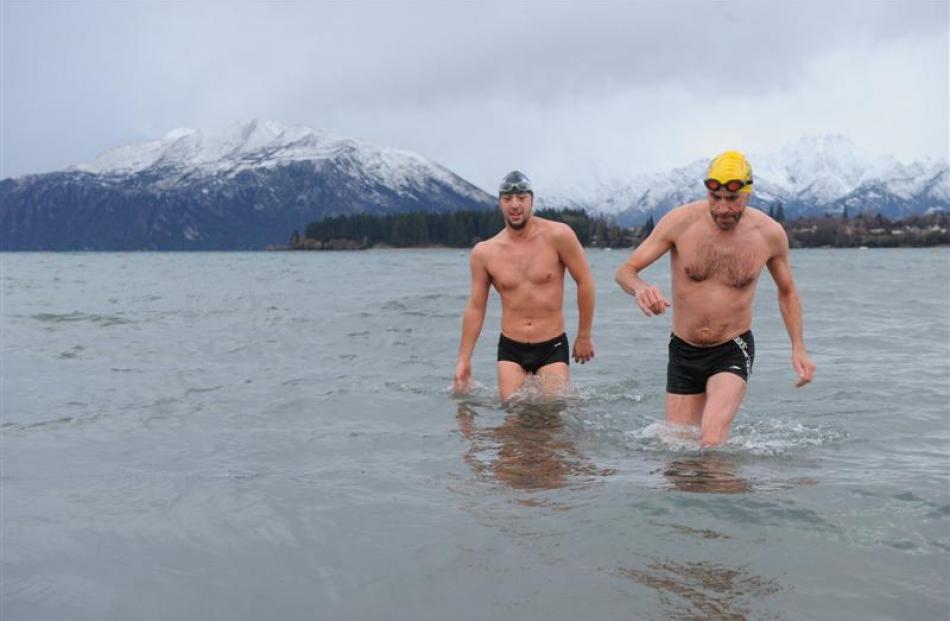 Sylvain Estadieu (left) and the late Pariac  Casey emerge from a chilly Lake Wanaka in July 2011...