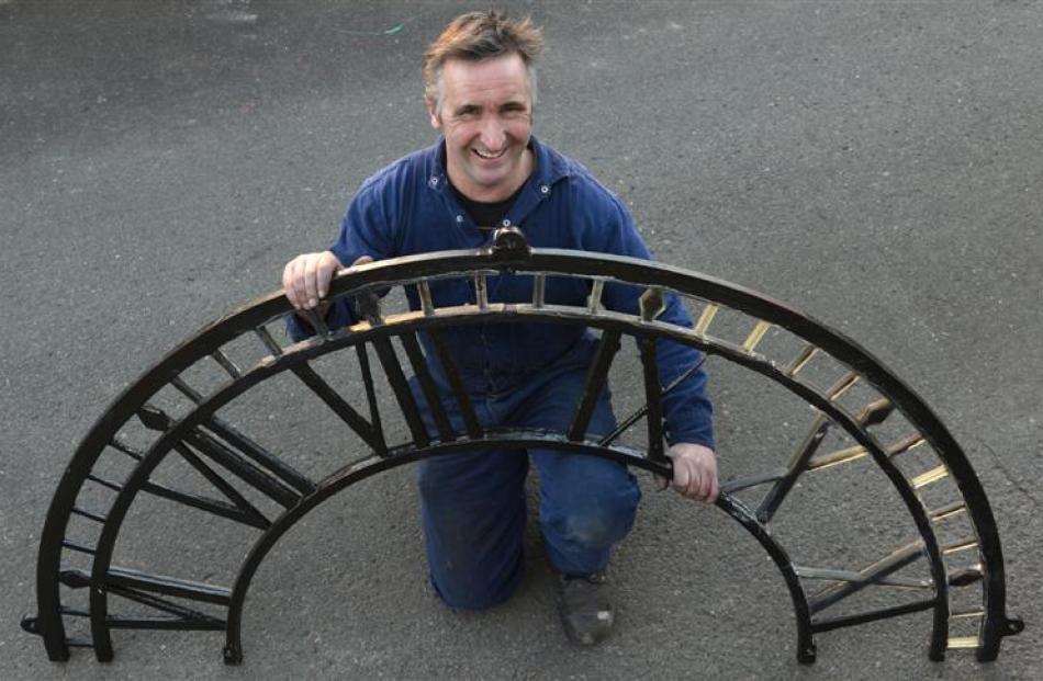 Zeal Steel owner Lawrie Forbes with half of the clock face from Port Chalmers' Iona Church he is...