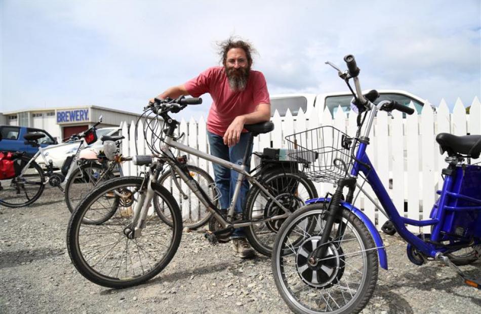 Zim Sherman, of Oamaru,  with two of his electric bikes. Photo by Rebecca Ryan.