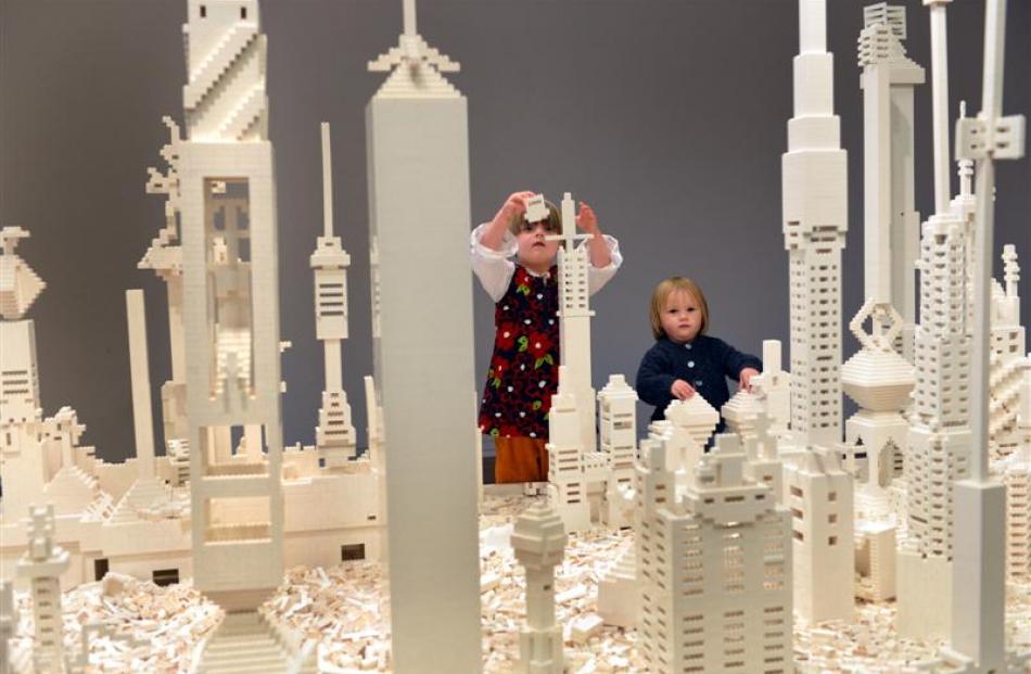 Zoe (4) and Erin (2) Patterson, of Dunedin, work on a city block at the Dunedin Public Art...