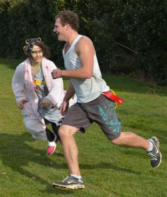 Zombie Lisa Randel chases down second place finisher Jason Downe (21).