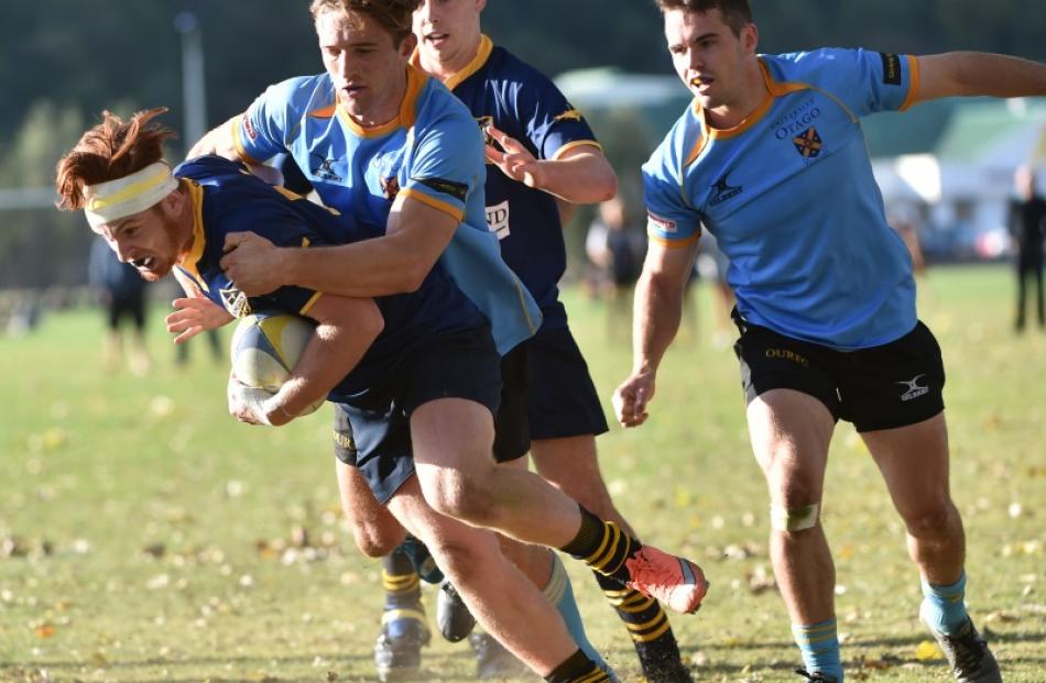 Action from today's match between Dunedin and University. Photo: Peter McIntosh