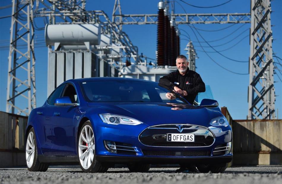 Better New Zealand trustee Sean Dick with his $220,000 Tesla S P90D electric supercar in Dunedin...