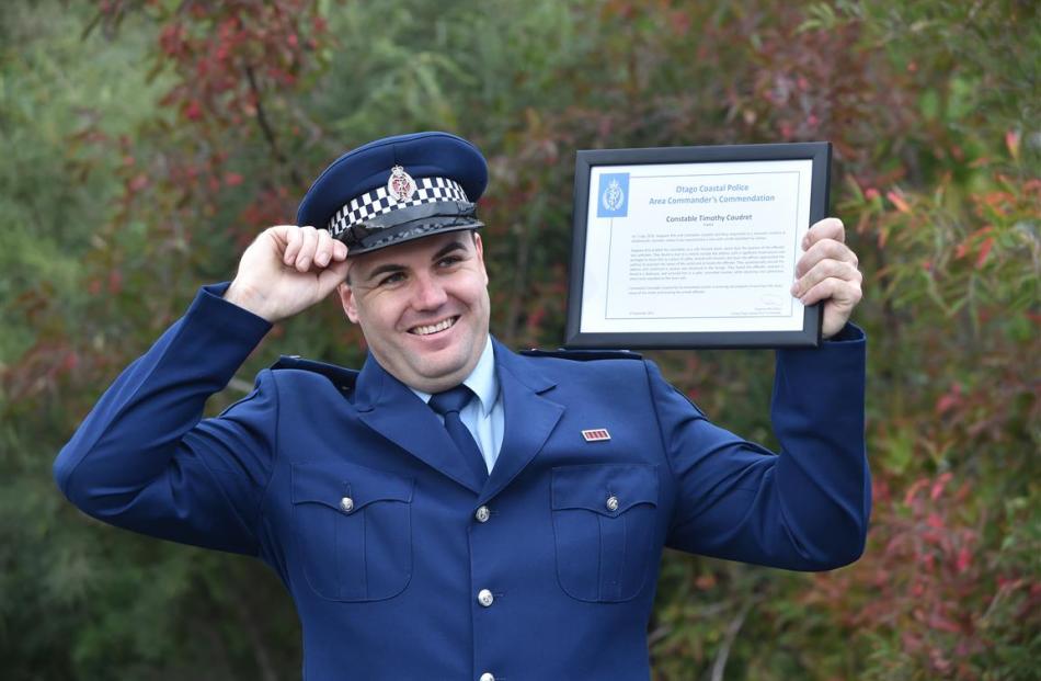 Constable Tim Coudret, of Dunedin, at the Mosgiel Fire Station yesterday with a commendation for...