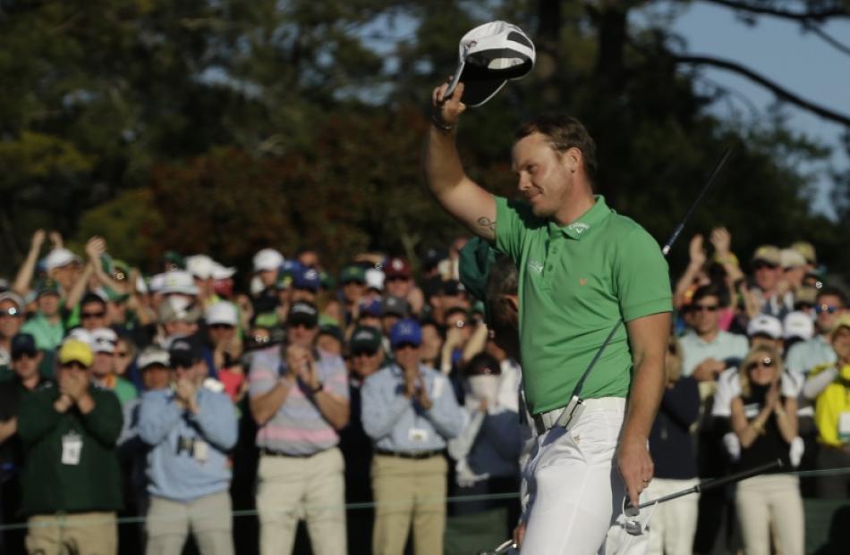 Danny Willett acknowledges the crowd after his final hole. Photo: Reuters