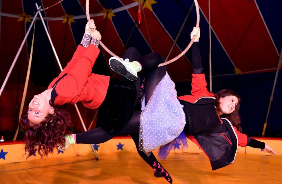 elly Chaproniere (left) and Shona Conacher perform an aerial stunt in the big top at  Circus...