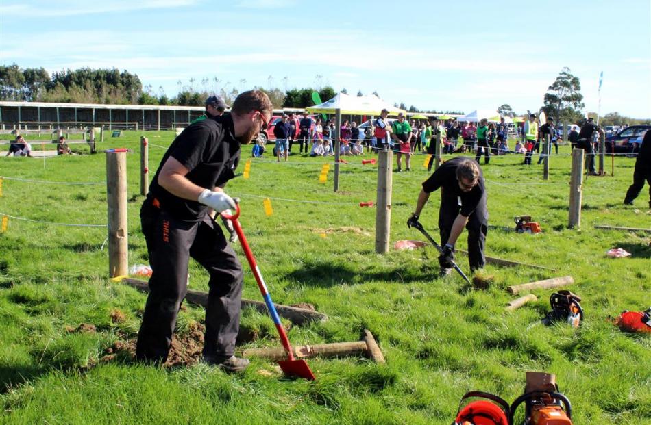 Eventual winner Logan Wallace, of Gore (left), a member of the Clinton Young Farmers Club, and...