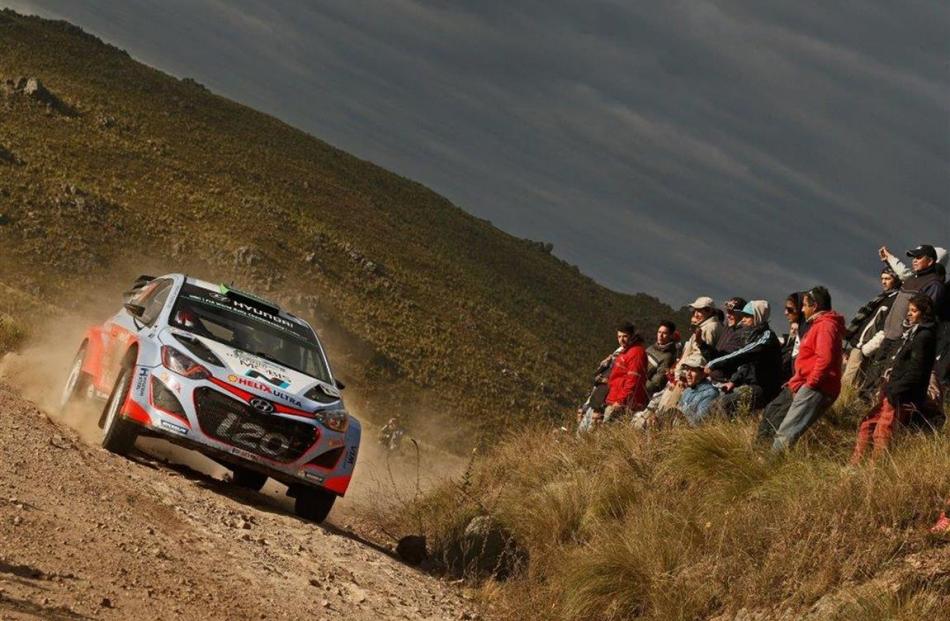 Hayden Paddon and John Kennard are pictured competing in the often rutted, sandy roads of Rally...