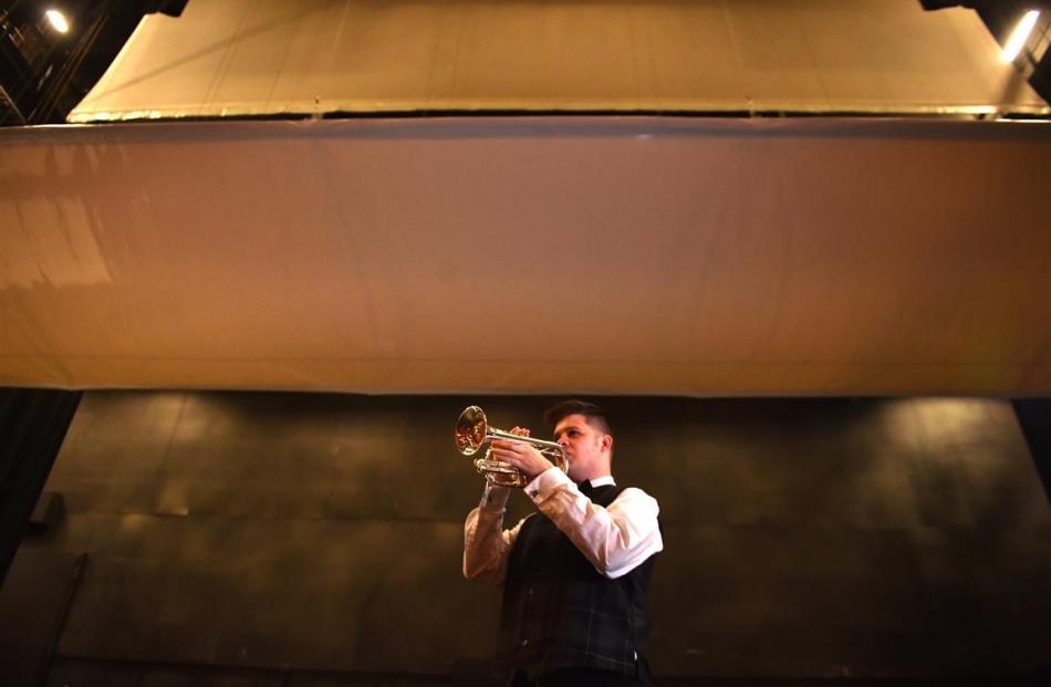 Kaikorai Metropolitan Brass principal cornet Mathew Patchett (26) tries out the acoustics of the...