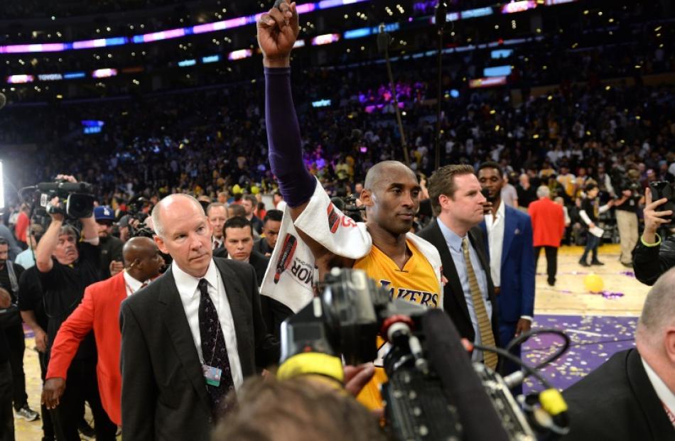 Kobe Bryant leaves the court after his last game. Photo: Reuters