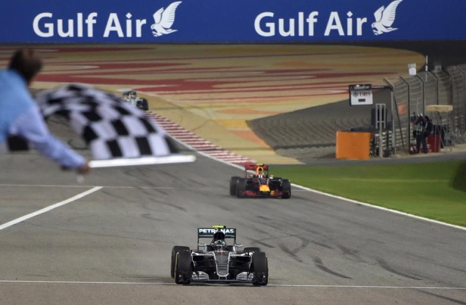 Nico Rosberg crosses the finish line ahead of Kimi Rakkonen and Lewis Hamilton. Photo: Reuters